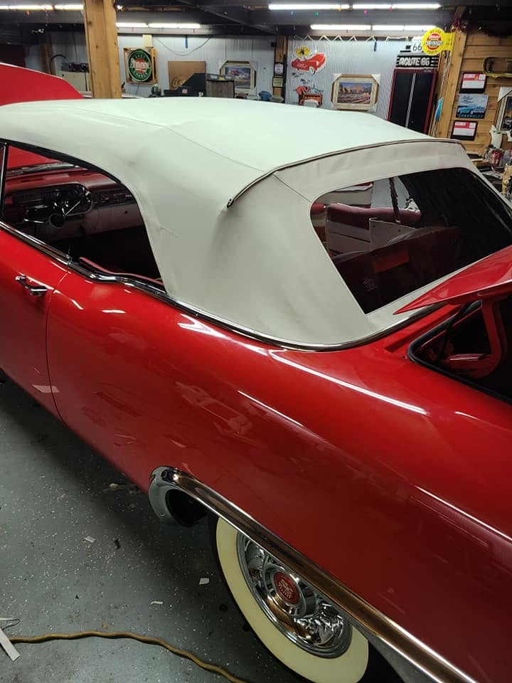 Restored classic convertible with a white top