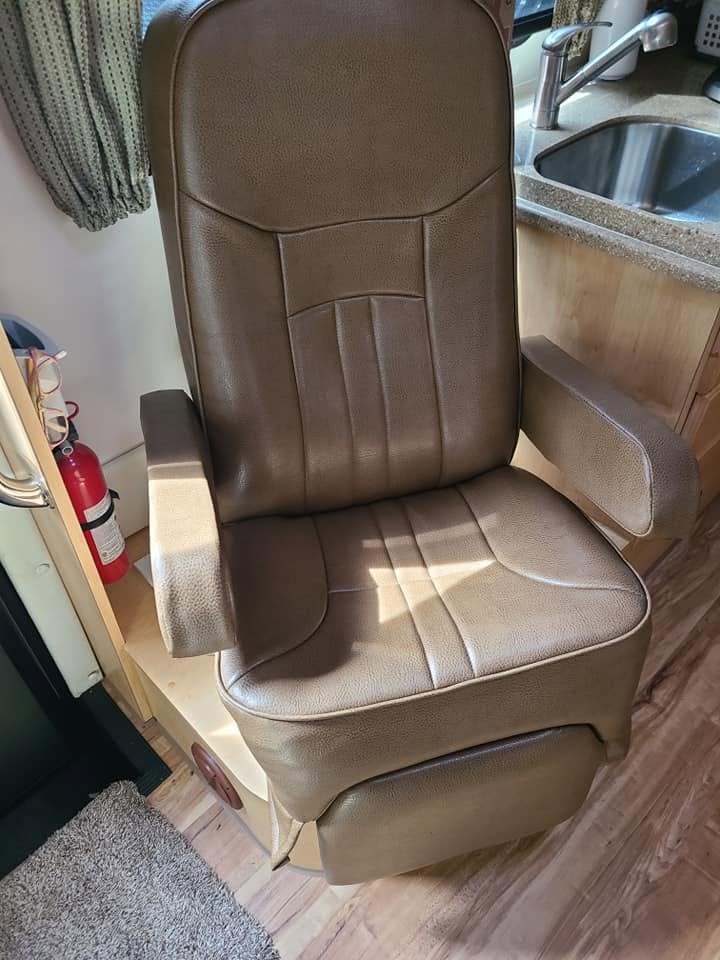 Brown leather high-back captain chair